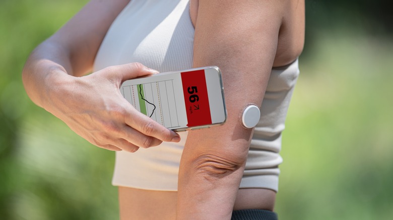 A woman monitors her glucose