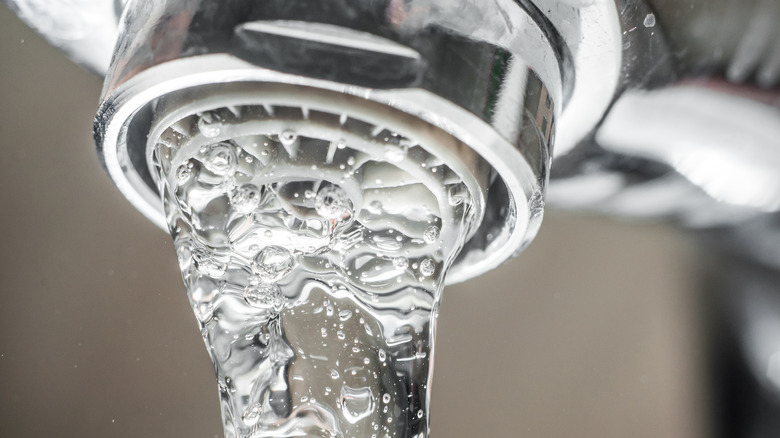 Close up water from faucet