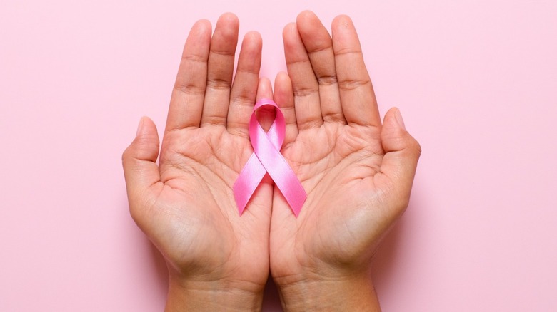 breast cancer pink ribbon hands