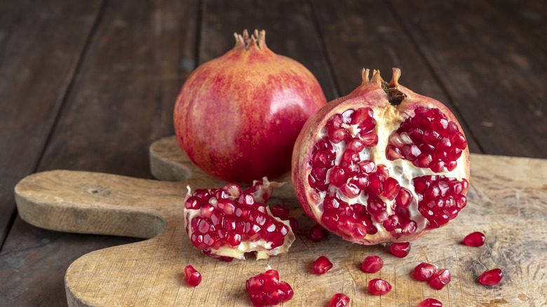 pomegranate on a cutting board