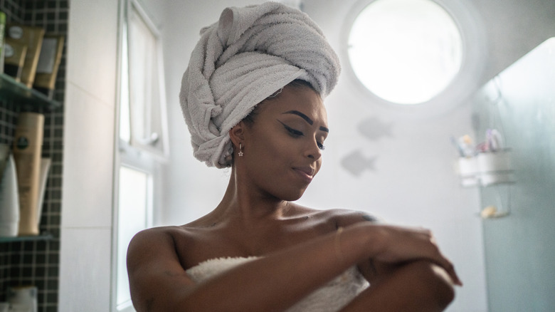 Woman getting out of the shower