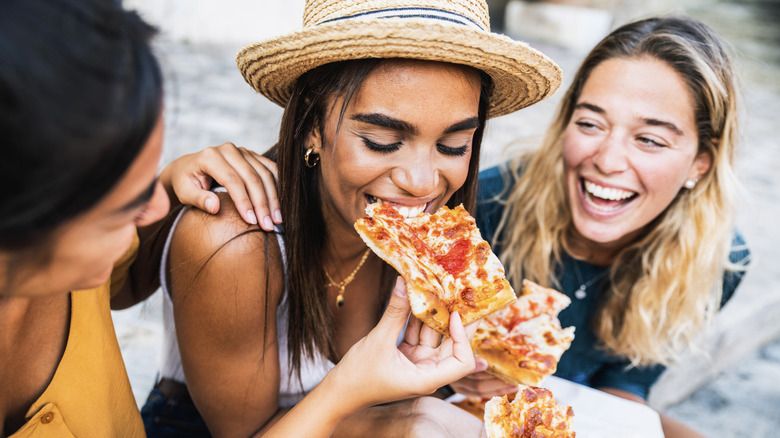 people eating pizza