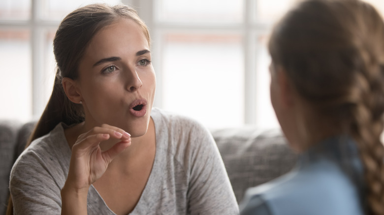 speech therapist working with patient