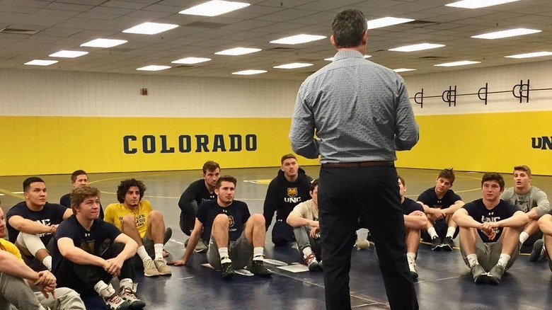 Dr. Jarrod Spencer speaking to a group of wrestlers