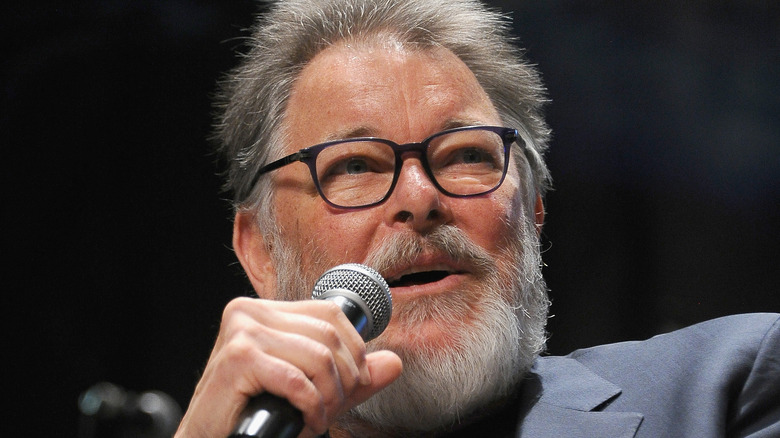 Jonathan Frakes speaking into microphone