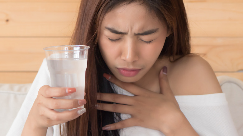 Woman experiencing chest pain
