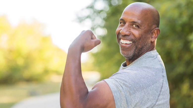 Man flexing and making a muscle
