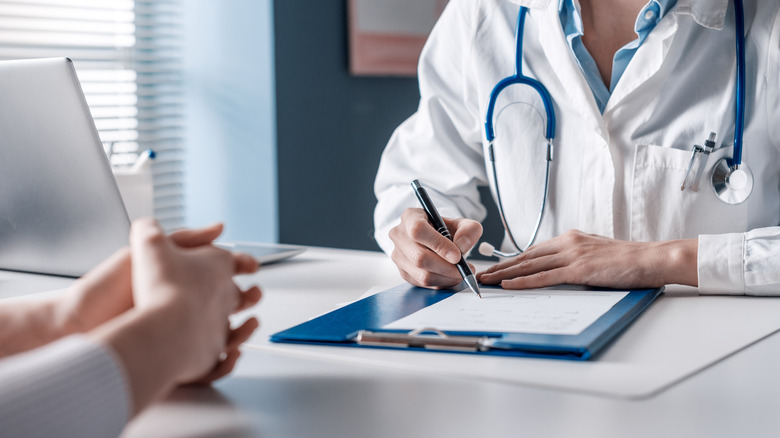 doctor taking notes