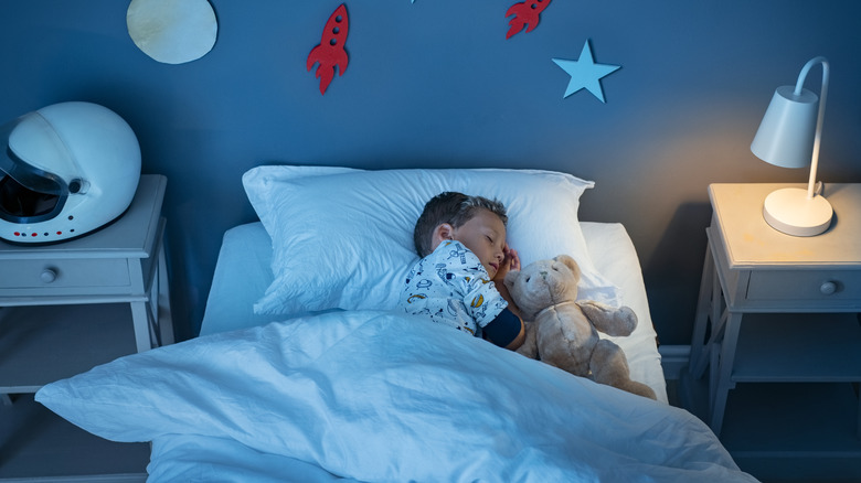 little boy sleeping in his room