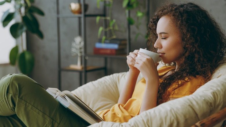 a woman enjoying a cup of coffee