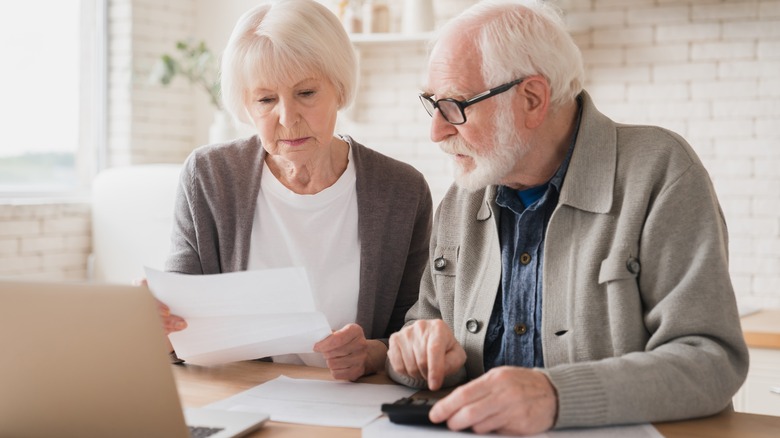 senior couple looking at paperwork