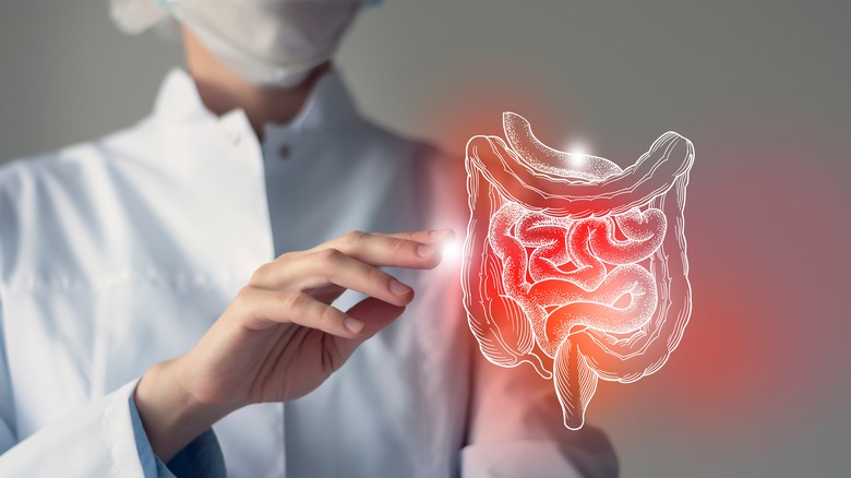 Masked doctor and colorectal diagram