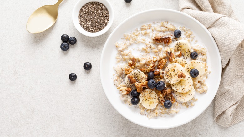 bowl of oatmeal, bananas, blueberries