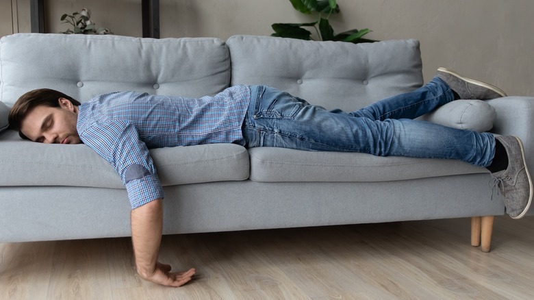 Person sleeping on couch sofa