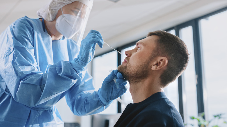 A man gets a COVID test