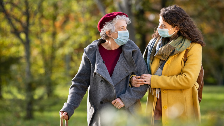 Two women walking in a park