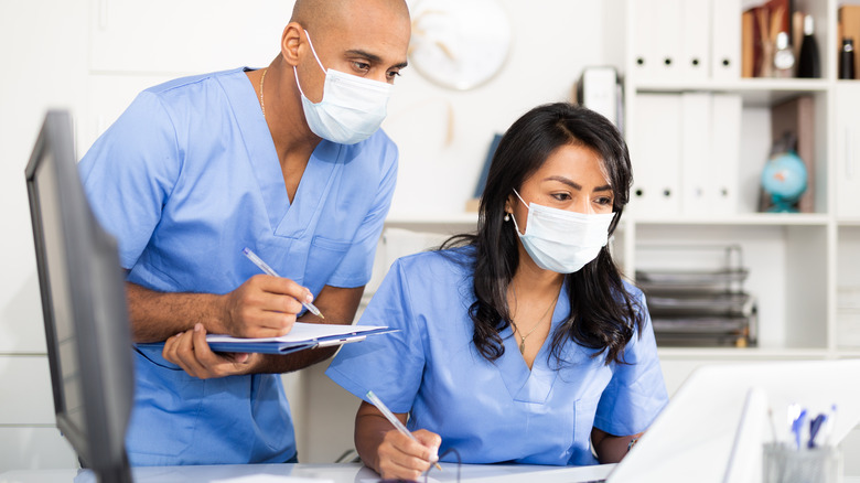 doctors looking at computer