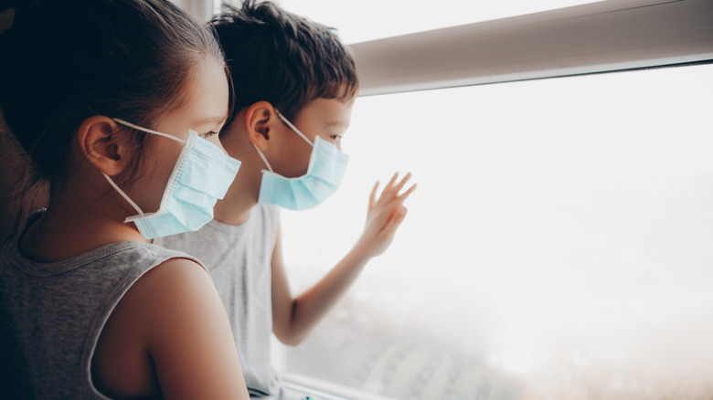 Masked kids in window