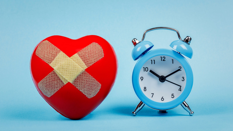 heart with bandage and clock