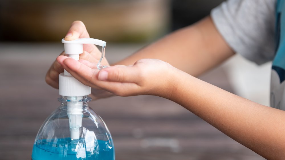 using hand sanitizer