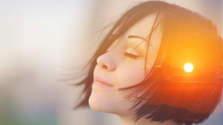 young woman envisioning sunshine