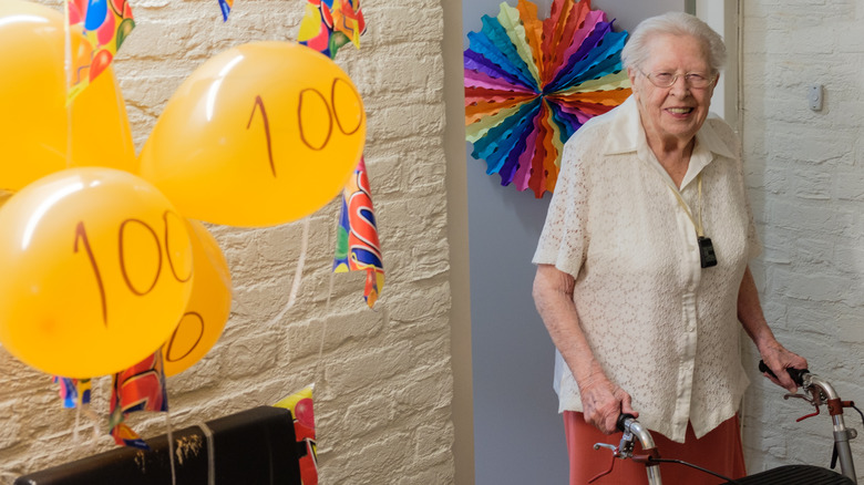 Woman turning 100 at birthday party