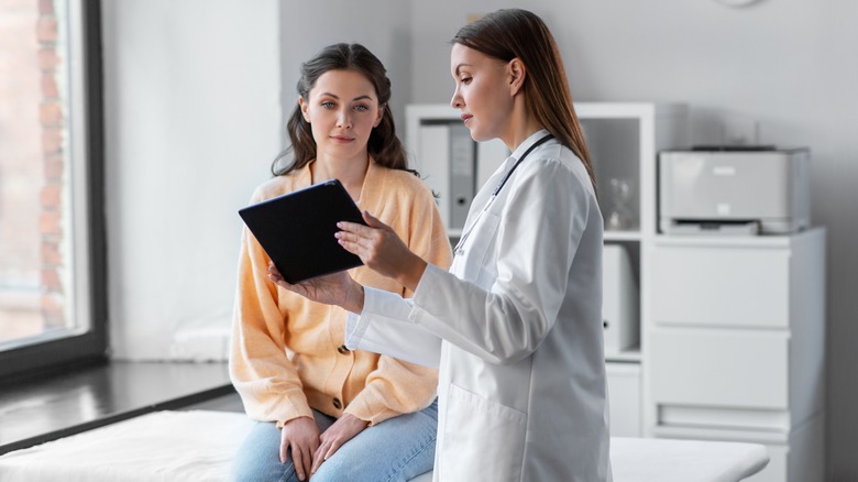 Female doctor with female patient