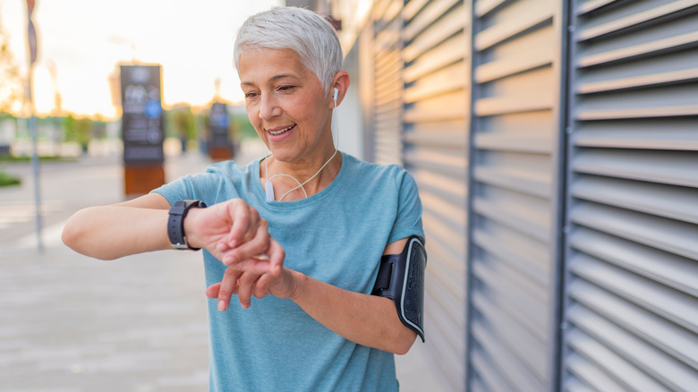 older woman checking smart watch