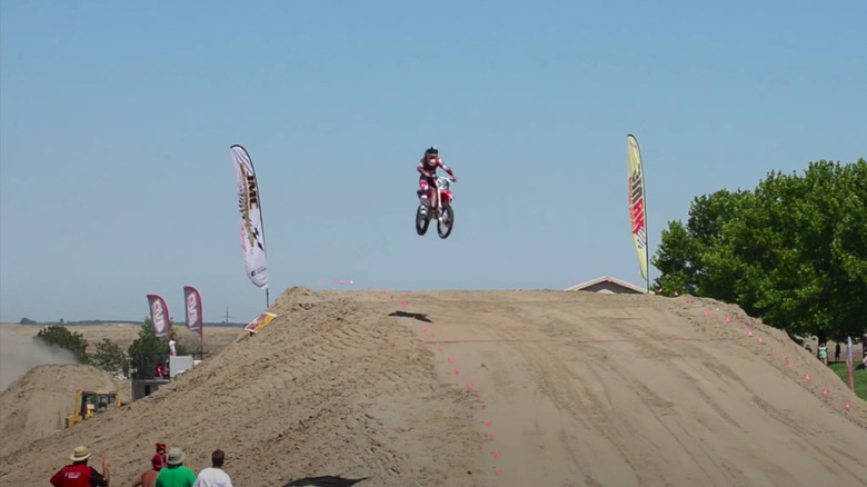 Alex Harvill, jumping on bike in 2013