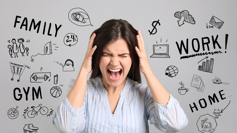 Stressed woman surrounded by words