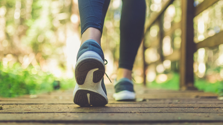 Close up of a woman's sneakers as she walks away