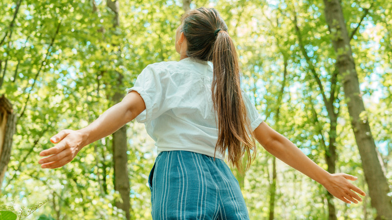 person walking in the woods
