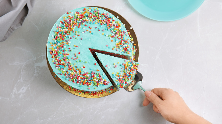 Someone gets a slice of birthday cake