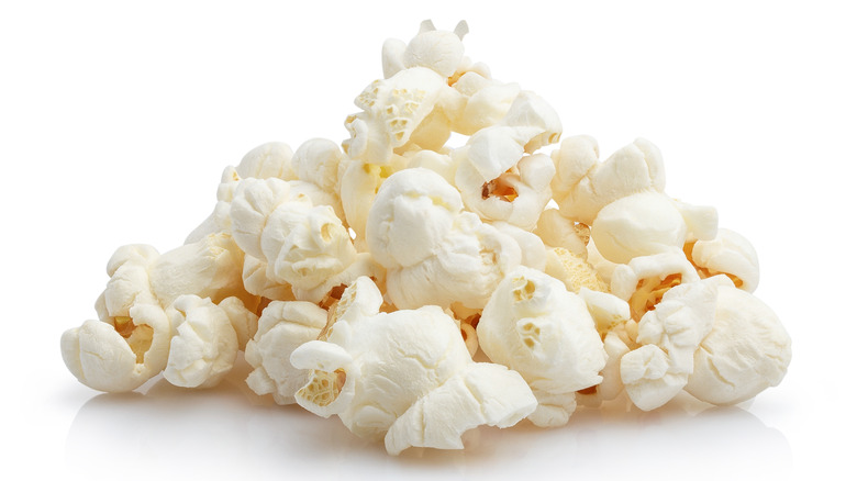 Close up of popcorn on a white background