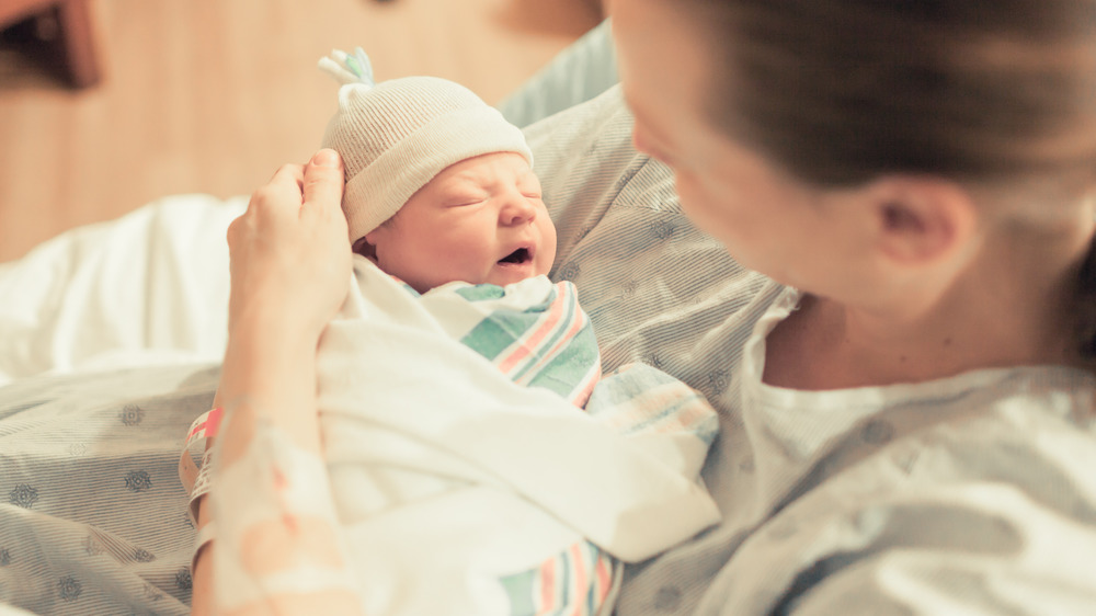 Mother holding newborn