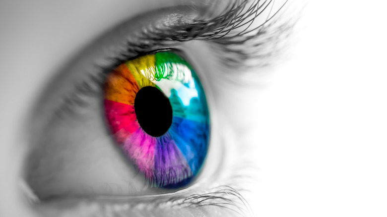 Close up of an eye where the iris is multicolored
