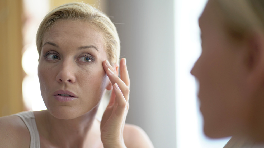 Woman looking in the mirror