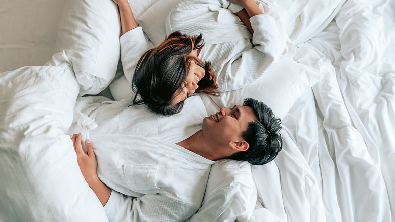 Couple relaxing in bed