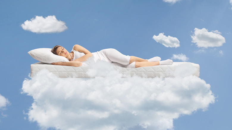 woman sleeping clouds