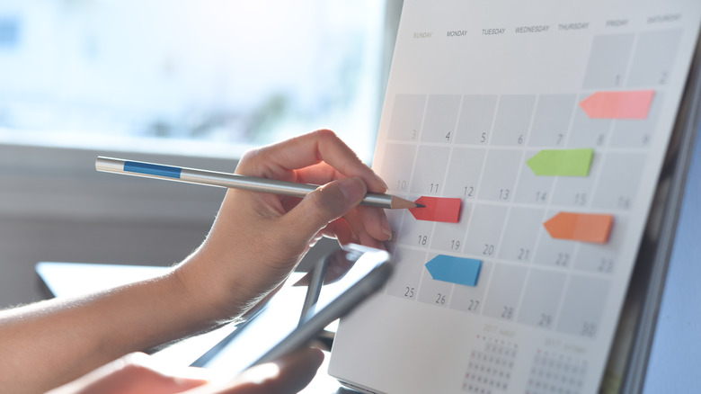Calendar with color-coded sticky notes