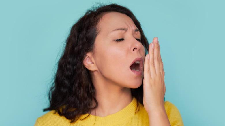 woman checking breath