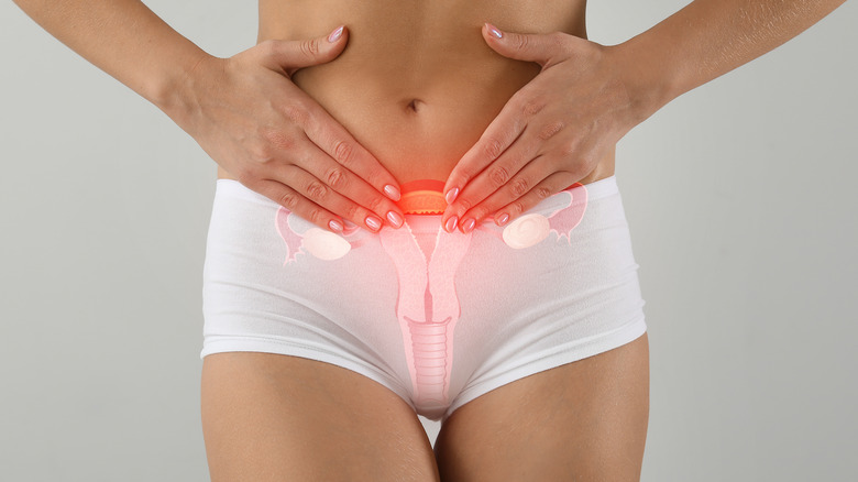 Woman holding her pelvic area