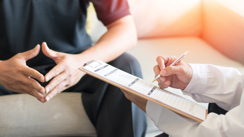 Man consulting with doctor