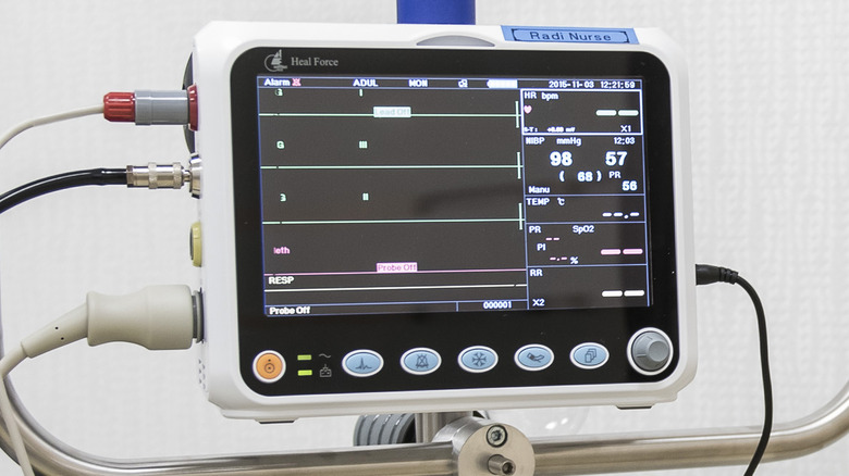 A blood pressure monitor stands in a diagnostic imaging area