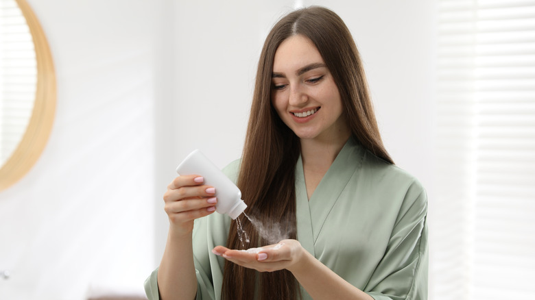 Woman applying talcum powder