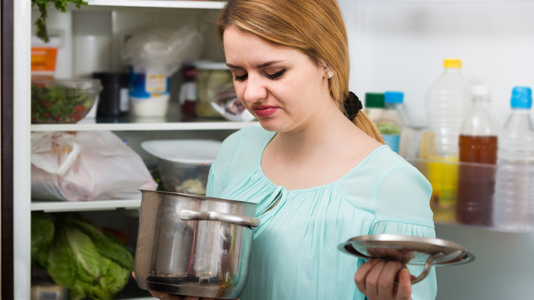 Woman noticing a foul smell