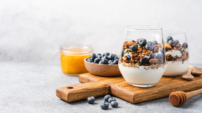 Yogurt parfait with berries, granola, almonds, and mixed seeds