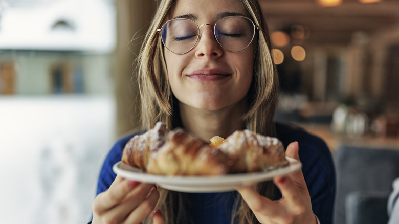 Woman holding plate of food 