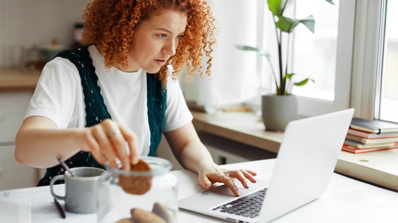 Woman snacking on cookies