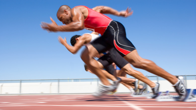 men running track at starting line